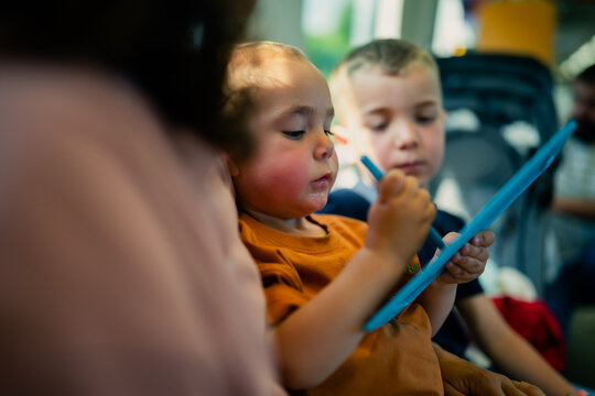 Toddler drawing on a digital tablet
