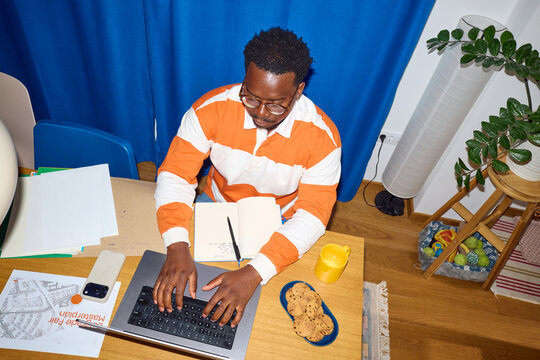 Man works in his dining room