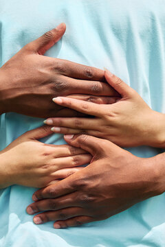 Couple's hands embracing, showing love and unity