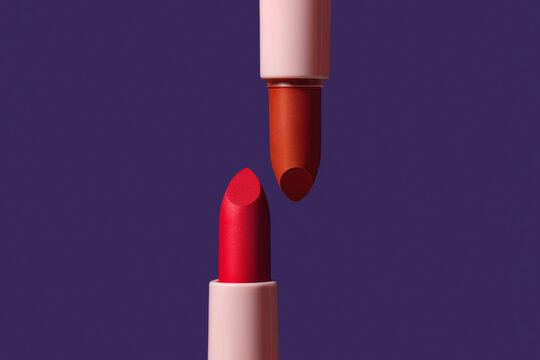 Lipsticks against a vibrant blue background