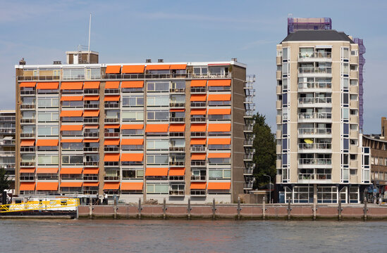 Waterfront Residential Apartment Buildings With Orange Awnings