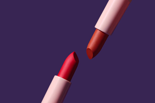 Lipsticks in vibrant shades against a deep blue background