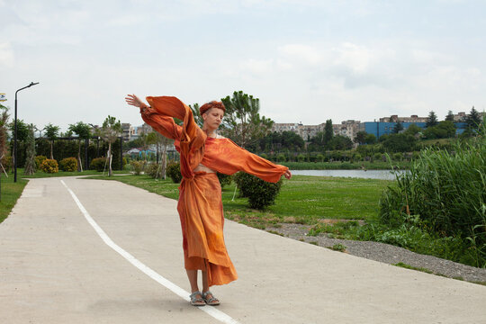 Walking in the terracotta dress