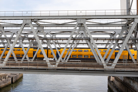 railway bridge with yellow train