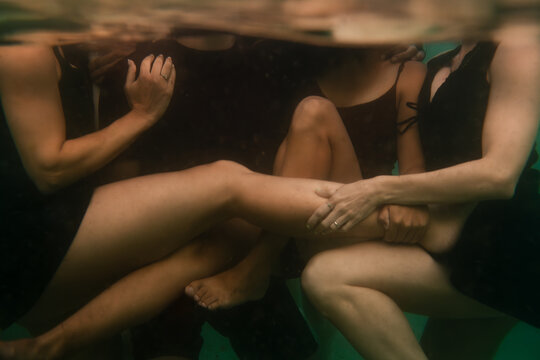 Underwater Tangle of friends bodies