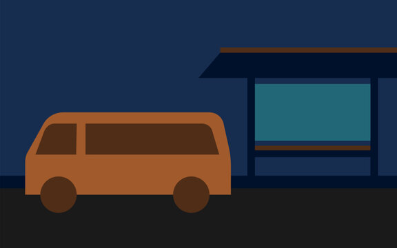 bus parked near a building or station at night
