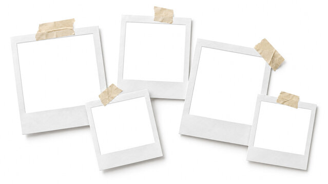 Blank instant photo frames taped to a white background for photo collage presentation.