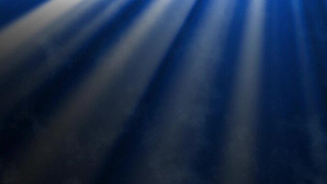 Dramatic blue light rays shining through smoke in dark atmospheric cinematic background