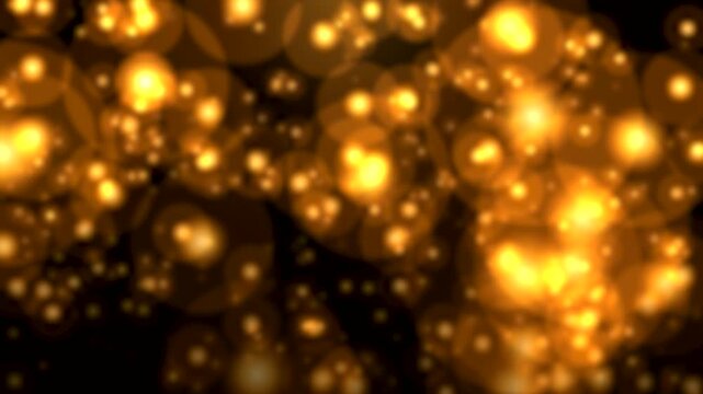 Dense Golden Bokeh Lights and Glowing Circles Shimmering on Dark Background