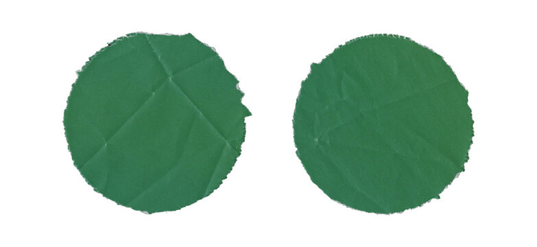 Set of two green circular paper cutouts with torn uneven edges, wrinkled and creased surfaces, handmade round shapes, and visible crumpled texture on transparent background