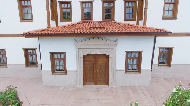 Historic wooden building exterior shows traditional craftsmanship and rustic facade details.