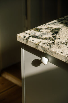 Modern kitchen interior with cabinet under marble countertop