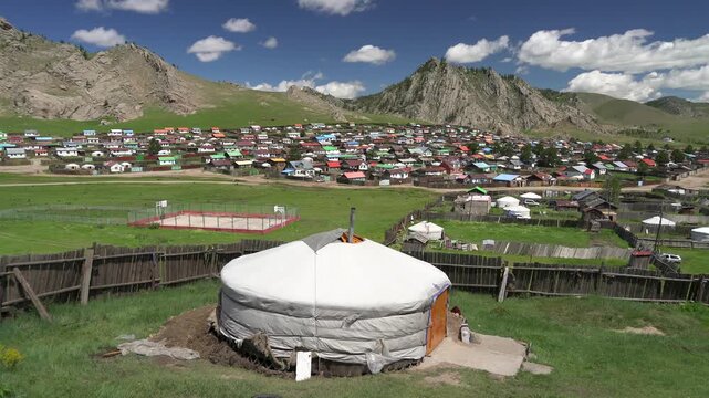 Tsetserleg Mongolia town with colorful roof houses and ger tents across a scenic valley.