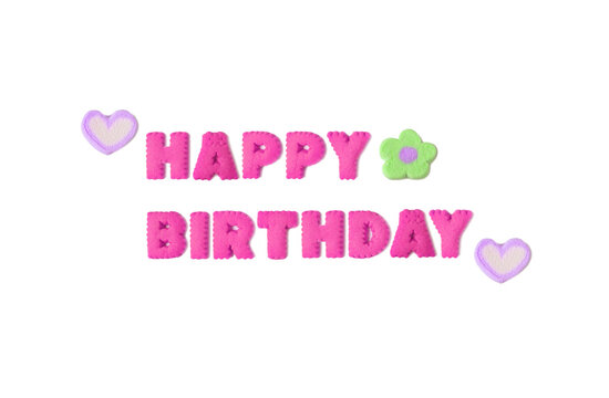 Greeting words spelled with orchid pink alphabet shaped cookies and flower shaped marshmallow on white background