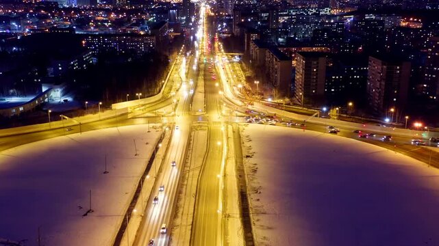 Ekaterinburg, Russia. Crossroads in the form rings. Interchange at night. Active traffic. Drone footage, Departure of the camera