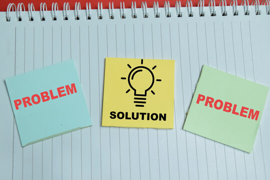 Concept of problem solving cycle write on sticky notes isolated on table. For showing one solution creates an new problem and critical thinking