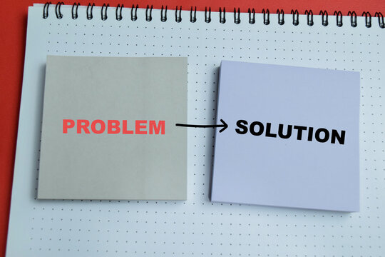 Concept of problem and solution write on sticky notes isolated on table. For decision making and planning