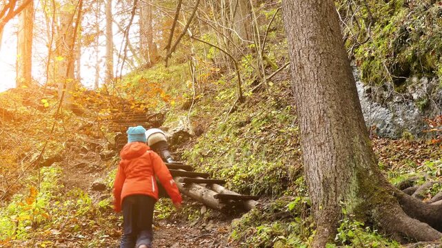 Two little beautiful girls walk in Slovak Paradise. Slovak Paradise (Slovensky raj) is mountain range in eastern Slovakia, part of Spis-Gemer Karst, located between towns of Spisska Nova Ves.
