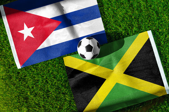 Cuba vs. Jamaica football match. National flags on green grass with soccer ball in the middle. Football background for international match.