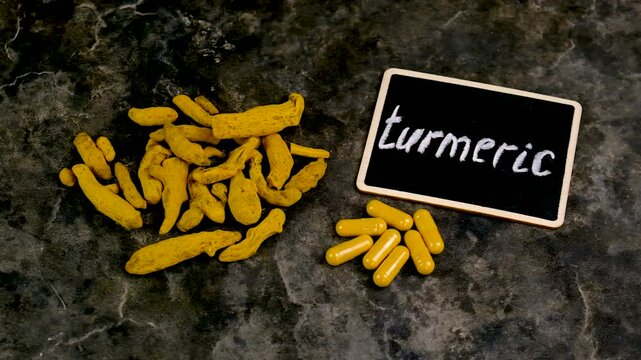 Turmeric root for supplements and essential oils. Selective focus.