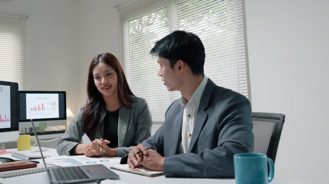 Business Team Discussing Financial Strategy in Office