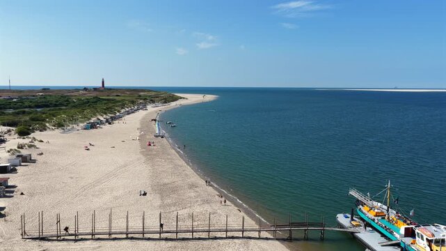 Aerial view of a ferry to Vlieland departing from the beach on Texel