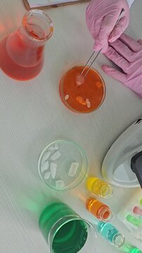 Mixing colors in a laboratory setting with different liquids and chemicals