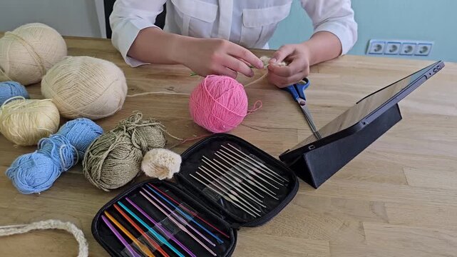 Knitting and crafting with colorful yarn on a wooden table