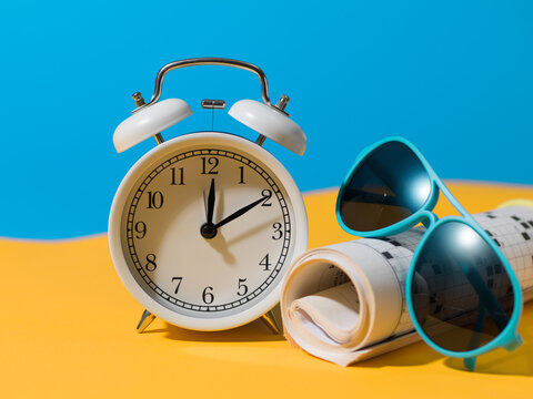 Vacation Time Concept with Alarm Clock and Sunglasses Banner