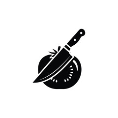 Obraz premium Dramatic black silhouette illustrating a sharp kitchen knife expertly slicing into a fresh tomato, signifying precise food preparation.