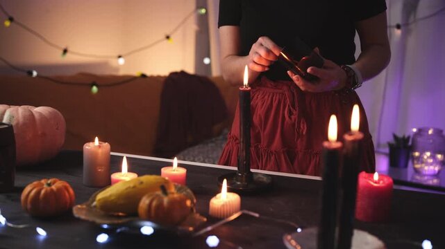Girl Decorates A Halloween Room By Lighting Candles And Creates A Festive Atmosphere