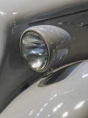 Detail of a headlight on a vintage car. © lapis2380