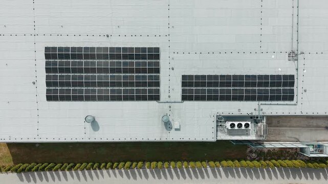 Industrial solar panel field on factory roof
