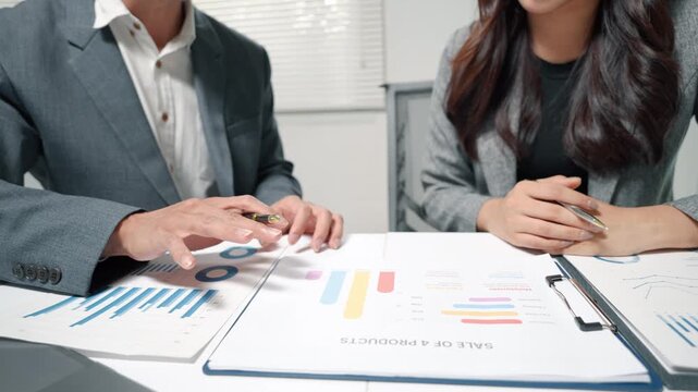 Business Team Discussing Sales Report in Office Meeting