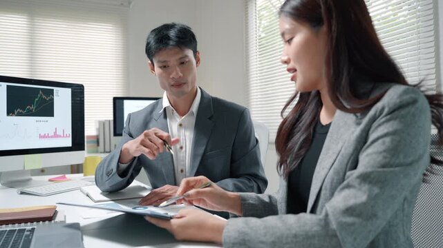 Business Team Discussing Financial Growth in Office