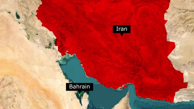 Satellite map view highlighting iran in red and location of bahrain in the middle east region