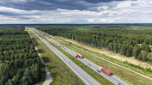 Aerial motorway with heavy traffic through rural Poland