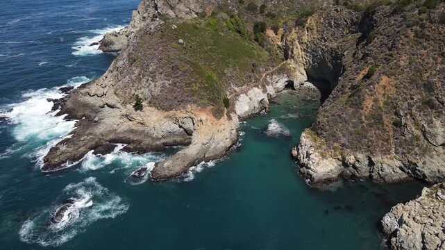 Aerial shot of the rugged coastline along the Pacific Coast Highway in Central California