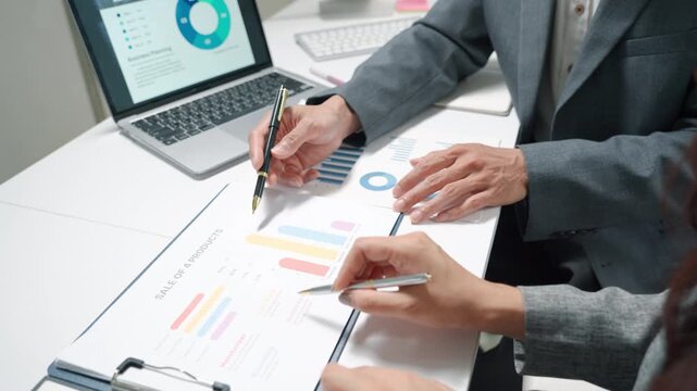 Business Team Reviewing Financial Charts in Meeting