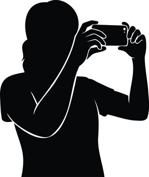 Black silhouette of a person holding a smartphone to take a or record isolated on a white background