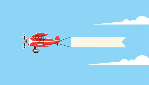 Red biplane flies through a blue sky with white clouds, pulling a long blank white banner for aerial advertising or messages.
