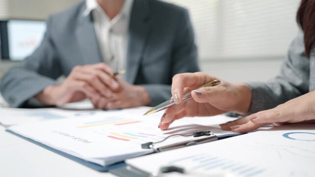 Business Team Reviewing Financial Charts