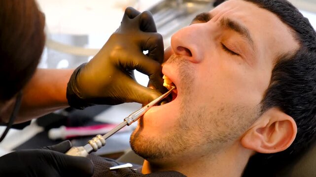 A man at a dentist appointment. Selective focus.