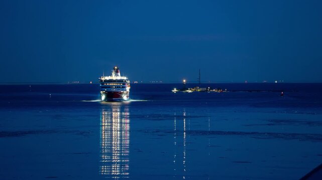 View of timelapse of Fata Morgana mirages over the Gulf of Finland featuring a distant ship and a lighthouse Helsinki, Uusimaa, Finland. Timelapse.