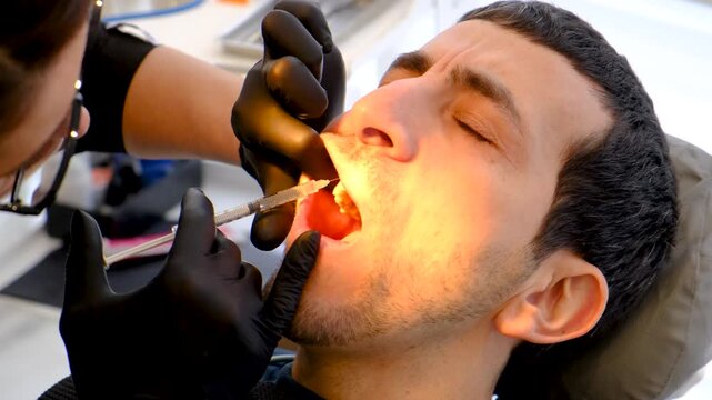 A man at a dentist appointment. Selective focus.