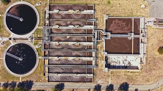Water treatment plant features multiple tanks used for filtration and purification of water. This setup supports the community's water needs.