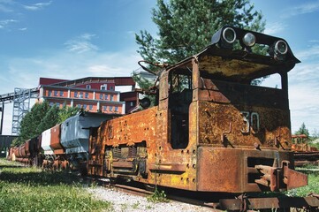 Vintage Rusted Mining Train with Wagons on Railway Track © Daniel