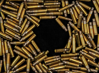 Empty rifle bullet casings background pattern © solidmaks