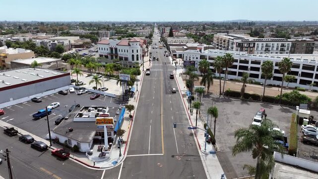 Bellflower, California, USA - Drone Aerial View Over Downtown Area With Local Stores, Retail Shops, Commercial Buildings, City Streets and Small-Town Business District on a Sunny Summer Day