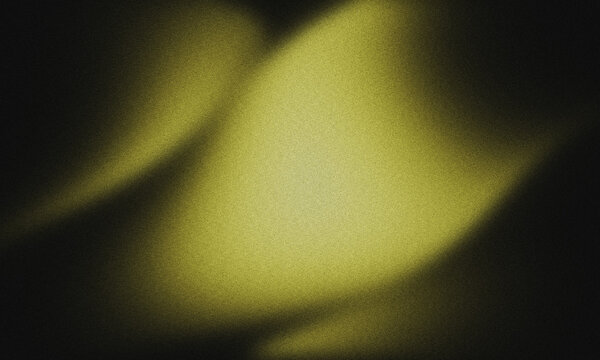 Abstract yellow light glow on a dark grainy background